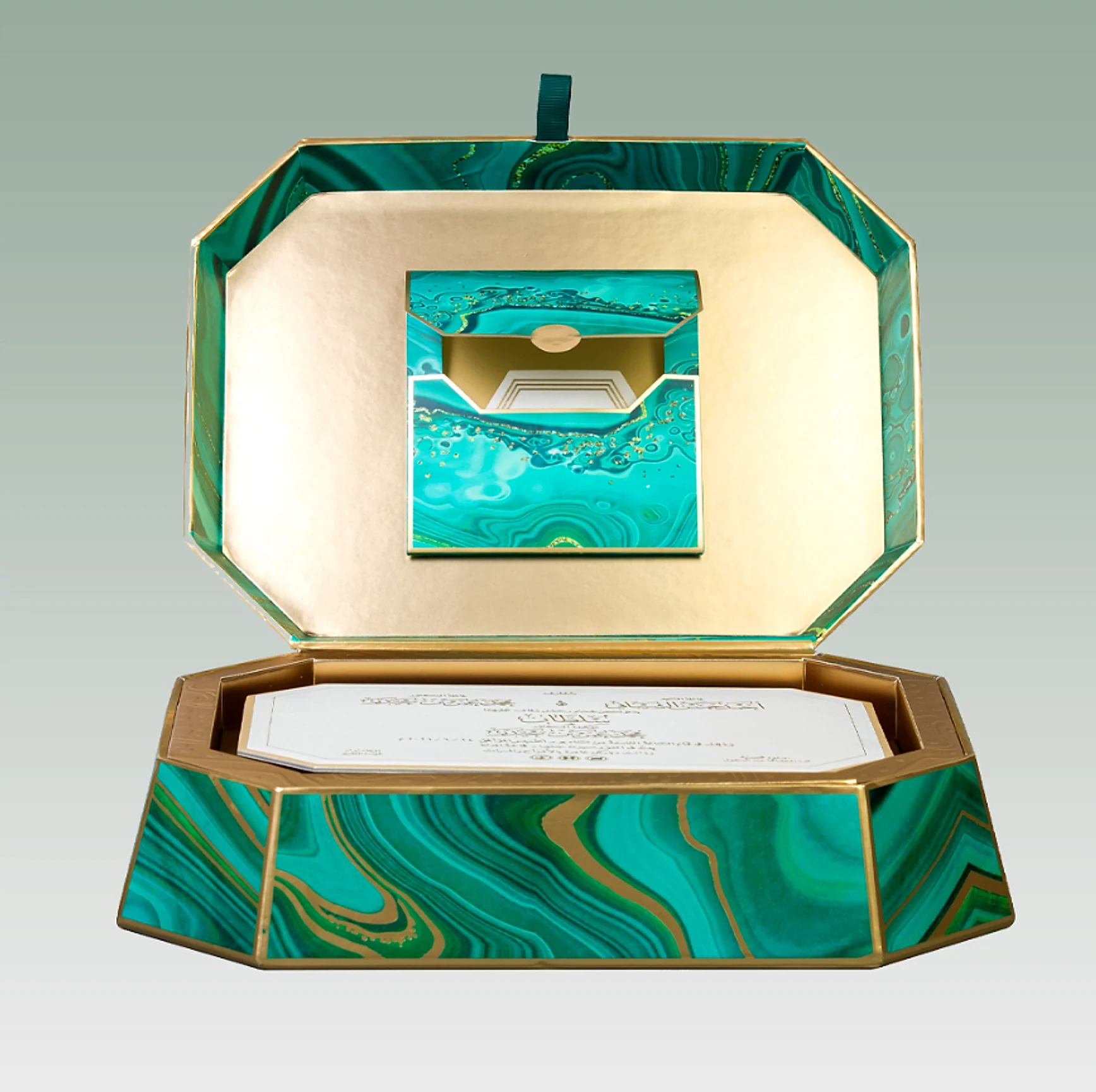The marble gift box opened to show the invitation and its envelope